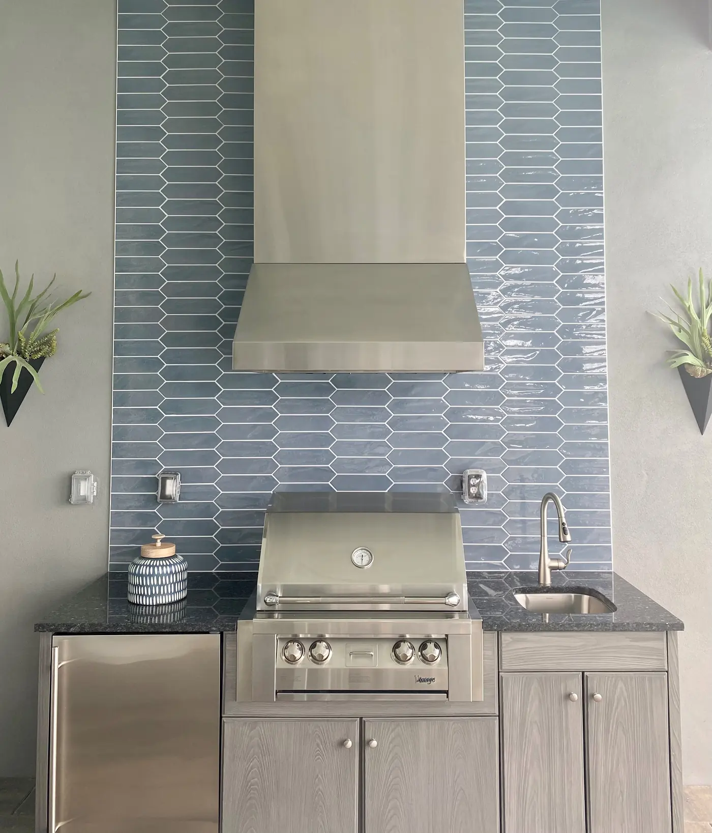 Outdoor kitchen supporting a broader Naples remodeling project